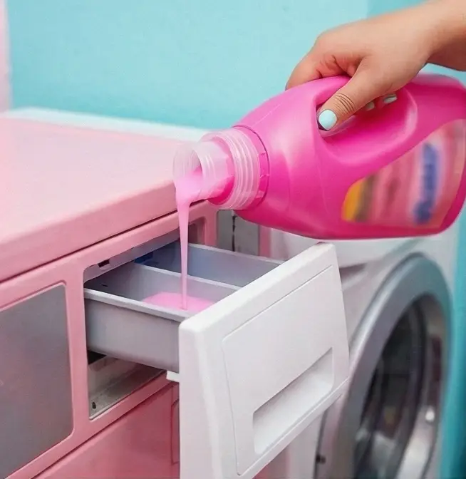 Adding Soap To Pink Washing Machine
